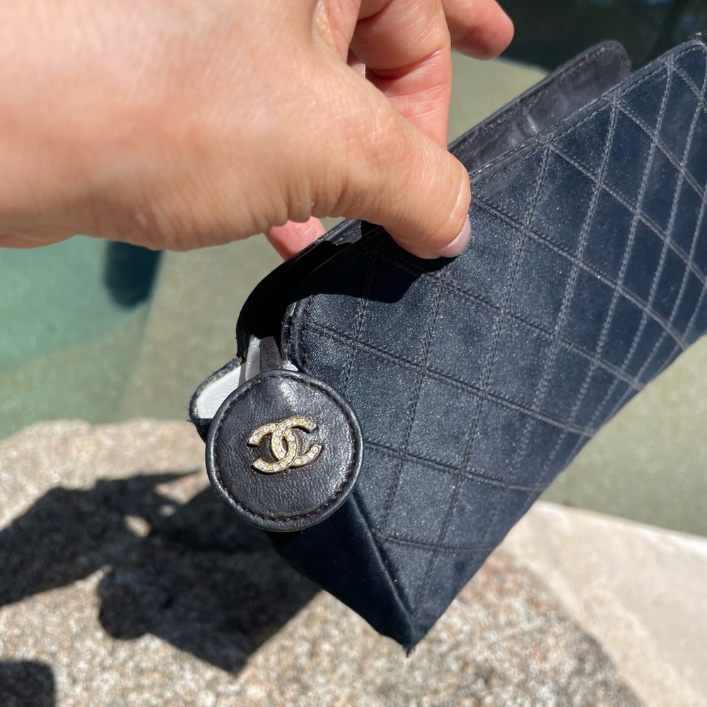 CHANEL Black Quilted Clutch with Gold Logo